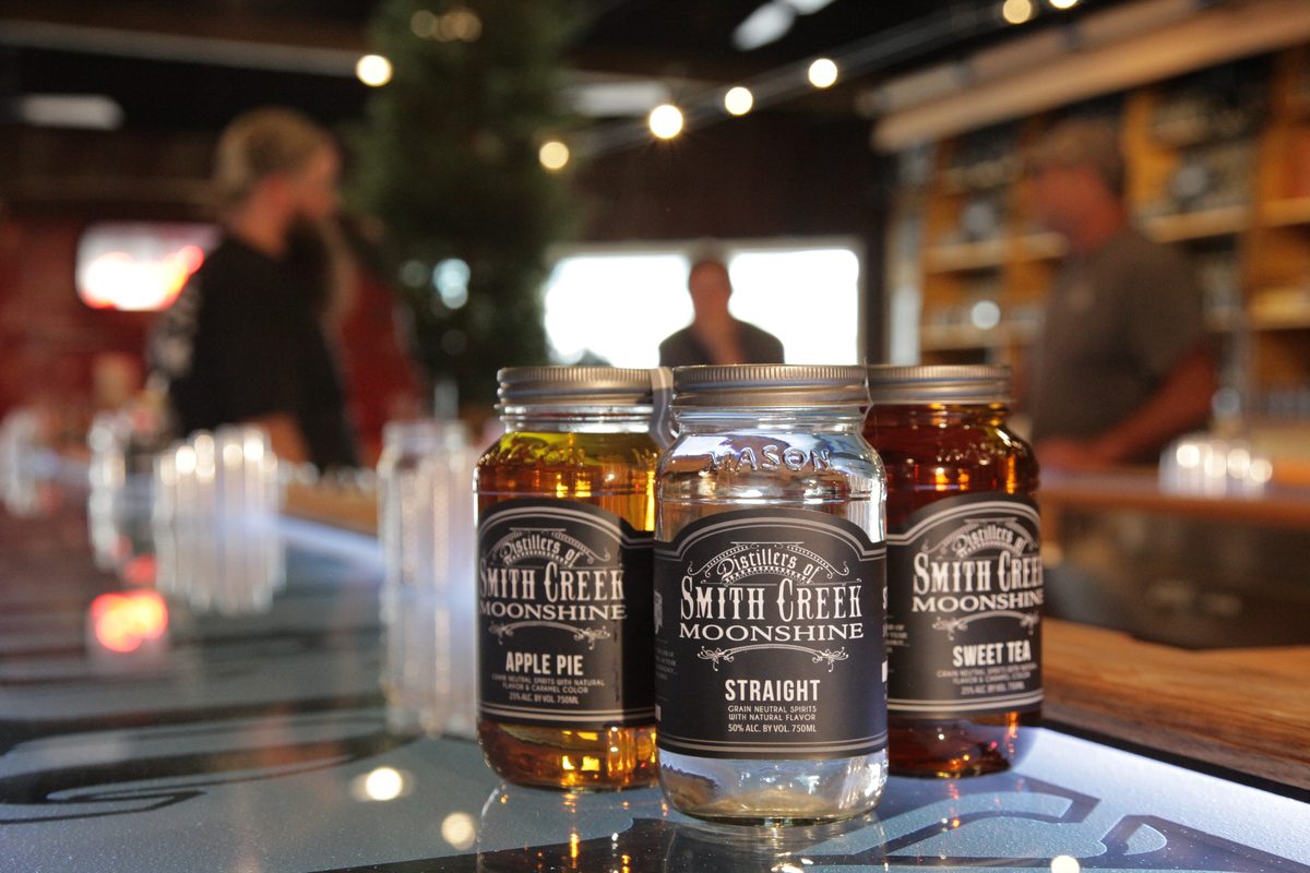 Jars of Smith Creek Moonshine on the tasting bar