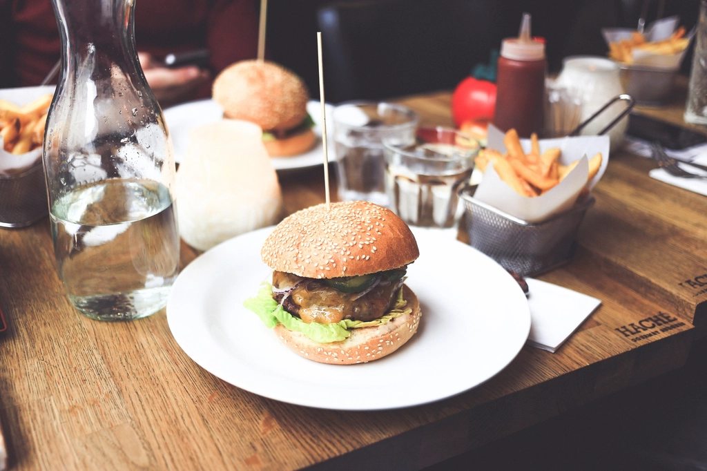 Illustrative photo of a burger and fries