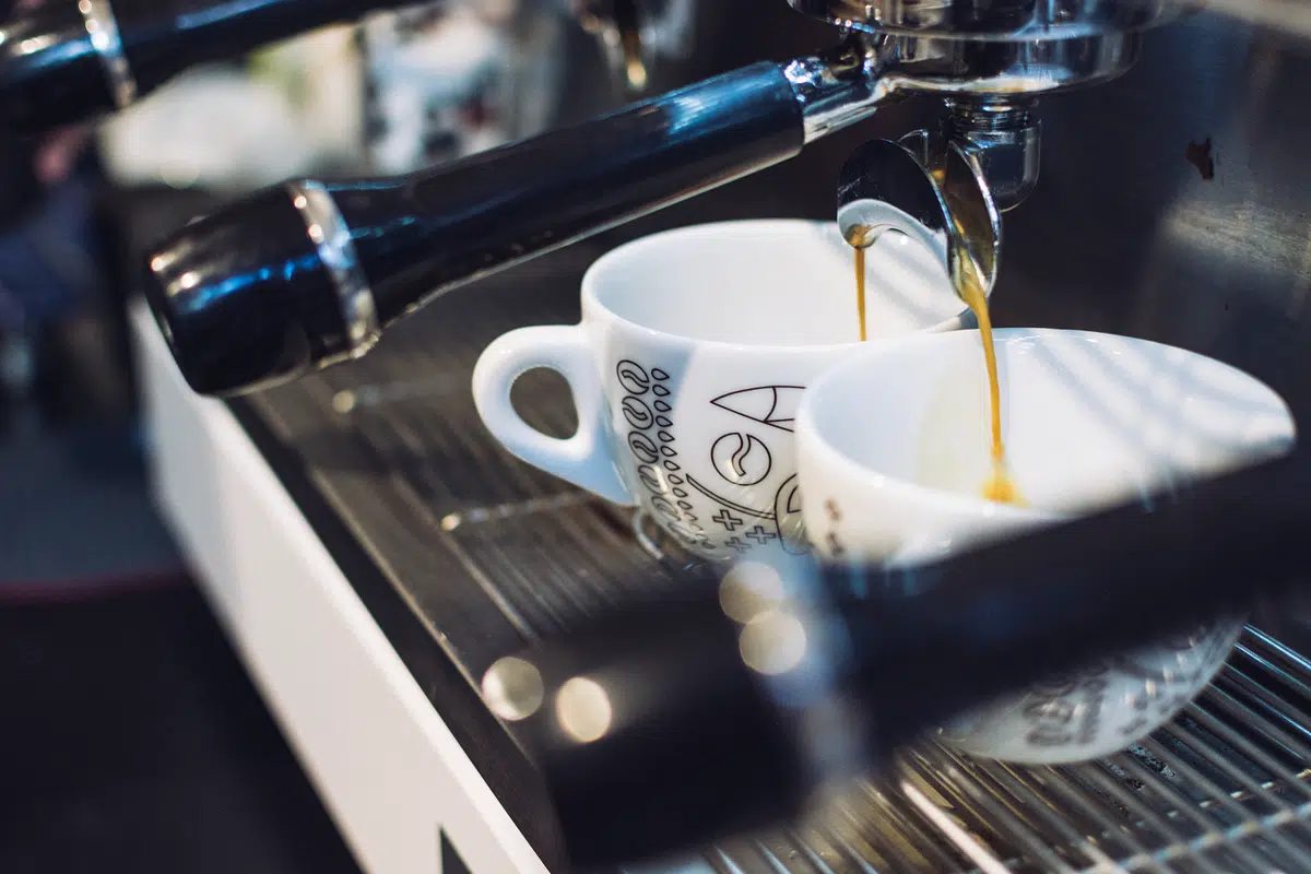 Illustrative photo of espresso pouring into cups
